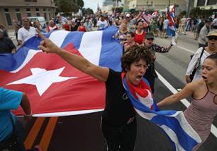 Image result for crowds flood streets of miami's little havana to cheer castro's death